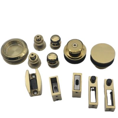 Système de porte coulissante SS304 sans cadre avec rouleaux en or polonais et style de conception sans cadre
