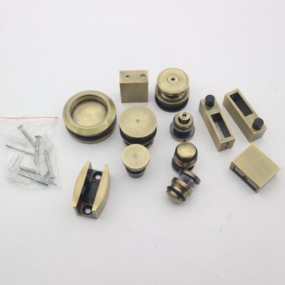 Système de porte coulissante SS304 sans cadre avec rouleaux en or polonais et style de conception sans cadre